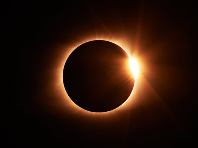 Photo of an eclipse to represent exhaustion and the need to declutter your mind.