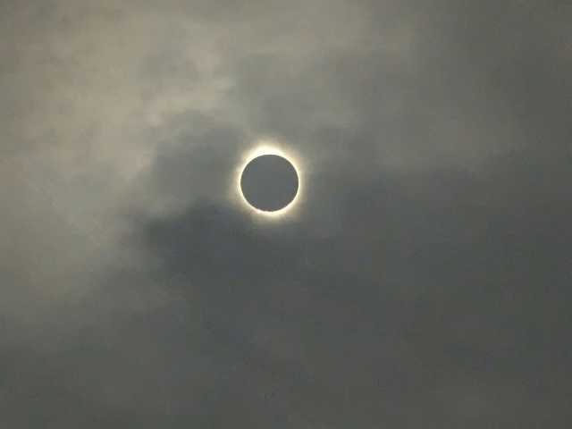 Photo of cloud-covered eclipse as a reminder to keep the faith in your murky writing projects
