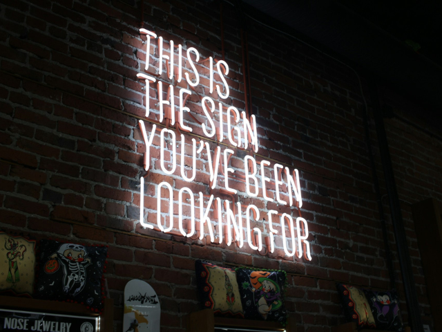 red neon sign that says this is the sign you've been looking for to illustrate the two kinds fo hunger