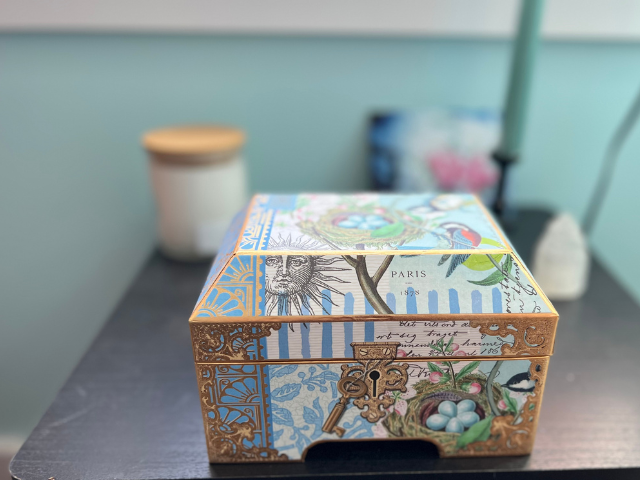 Photo of a box with a blue bird on it that I use to embrace uncertainty