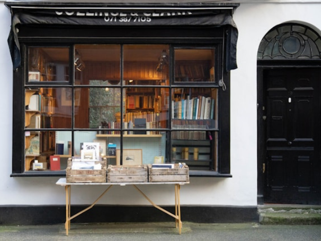photo of book store window with a table out front to illustrate is publishing your book the only metric that matters